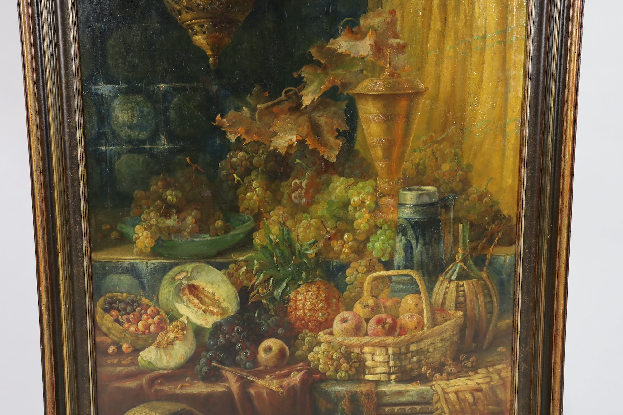 John Frank Swingler (British, 1850-1900), Still life of fruits, a gold vessel and a mandolin upon a table top, oil on canvas, 136 x 95cm